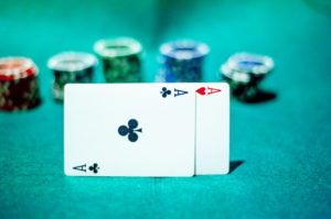 blackjack in a casino, a man makes a bet, and puts a chip
